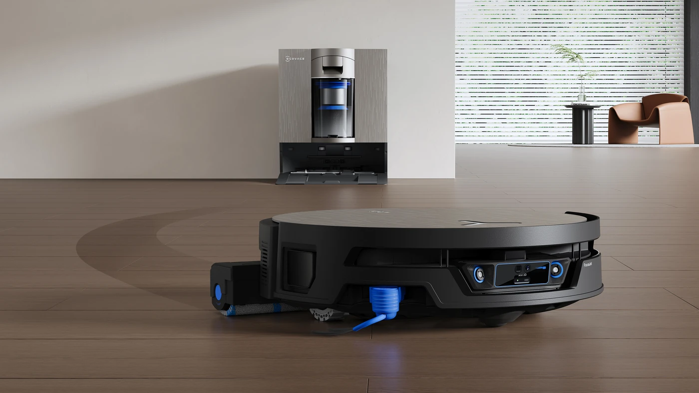 Робот-пилосос ECOVACS DEEBOT X12S OmniCyclone на підлозі перед своєю док-станцією