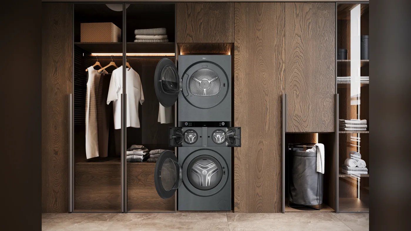 Пральний комплекс Haier Multi Care Laundry Studio колоною в гардеробній, дверцята барабанів відчинені